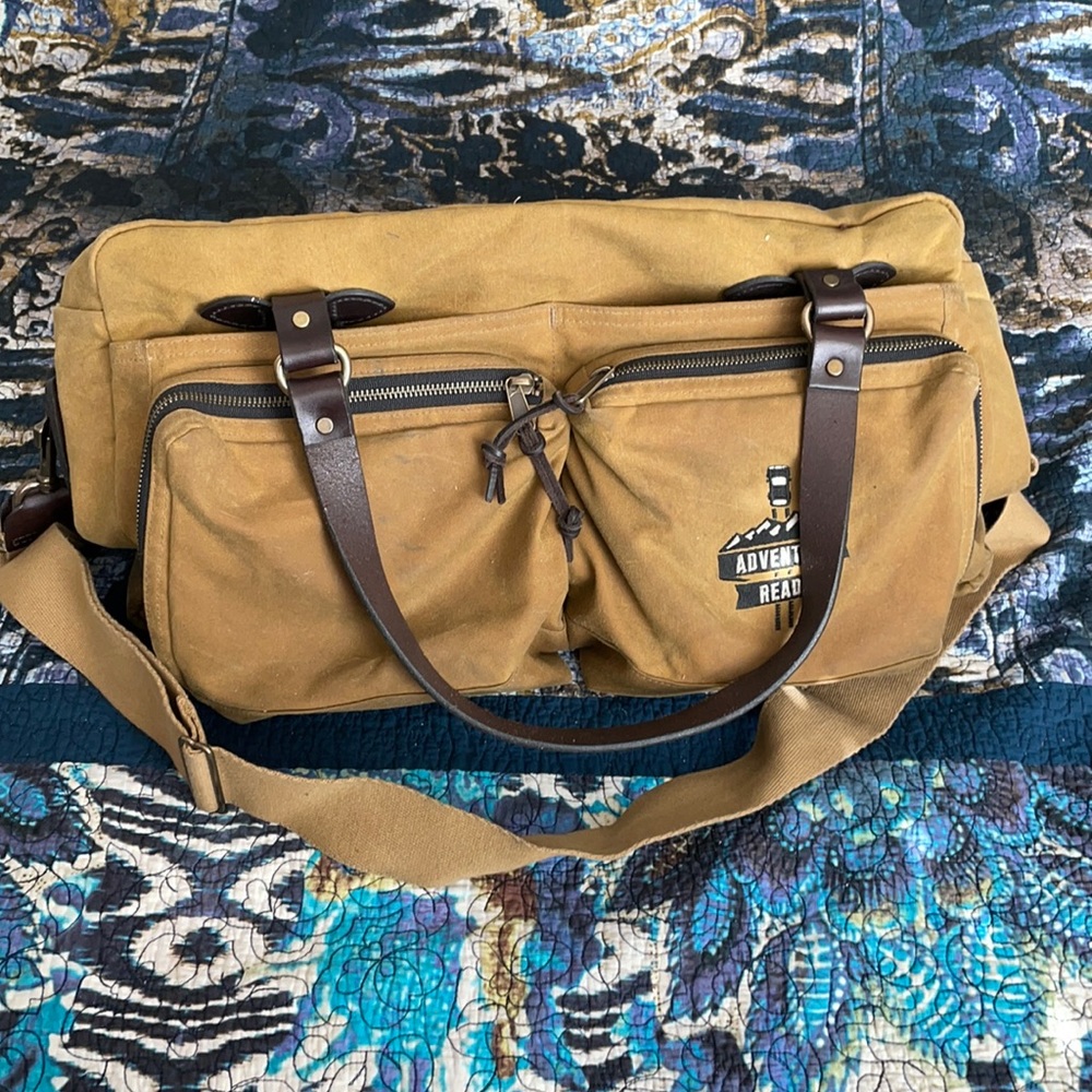 Filson 48 hour tin cloth duffel bag. Adventure Ready Logo